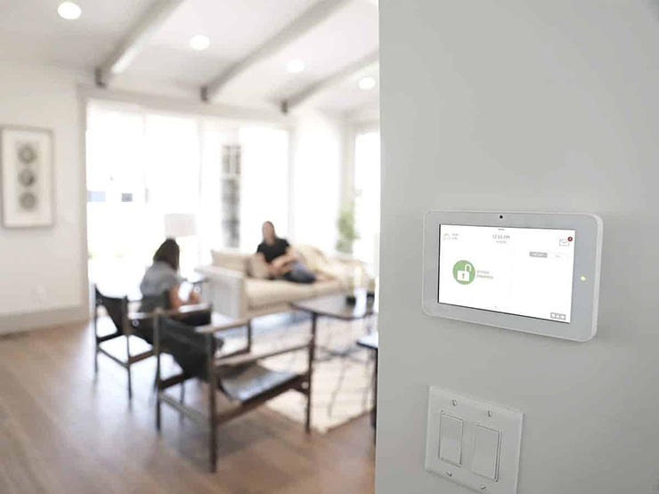 professional security camera installation on building exterior with technician working